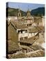 Old Buildings with Tiled Roofs and a Church Behind at Estella on the Camino in Navarre, Spain-Ken Gillham-Stretched Canvas