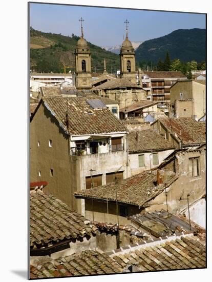 Old Buildings with Tiled Roofs and a Church Behind at Estella on the Camino in Navarre, Spain-Ken Gillham-Mounted Photographic Print