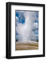 Old Faithful erupts Yellowstone-null-Framed Art Print