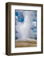 Old Faithful erupts Yellowstone-null-Framed Art Print