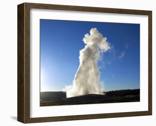 Old Faithful Geyser Erupting at Sunset, Yellowstone National Park, Wyoming-Maureen Eversgerd-Framed Photographic Print