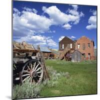 Old Farm Wagon and Derelict Wooden and Brick Houses at Bodie Ghost Town, California, USA-Tony Gervis-Mounted Photographic Print