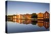 Old Fishing Warehouses Reflected in the River Nidelva-Doug Pearson-Stretched Canvas