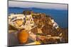 Old fortress and houses on the coast of Aegean Sea. Oia, Santorini Island, Greece.-Keren Su-Mounted Photographic Print