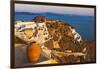 Old fortress and houses on the coast of Aegean Sea. Oia, Santorini Island, Greece.-Keren Su-Framed Photographic Print