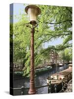 Old Gas Lamp Post and Bicycles on a Bridge over a Canal in Amsterdam, the Netherlands-Miva Stock-Stretched Canvas