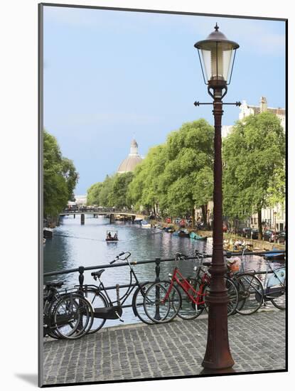 Old Gas Lamp Post and Bicycles on a Bridge over a Canal in Amsterdam, the Netherlands-Miva Stock-Mounted Photographic Print