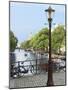 Old Gas Lamp Post and Bicycles on a Bridge over a Canal in Amsterdam, the Netherlands-Miva Stock-Mounted Photographic Print