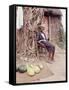 Old Haitian Woman in Front of Her Hut-Lynn Pelham-Framed Stretched Canvas