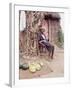 Old Haitian Woman in Front of Her Hut-Lynn Pelham-Framed Photographic Print