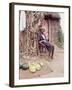 Old Haitian Woman in Front of Her Hut-Lynn Pelham-Framed Photographic Print