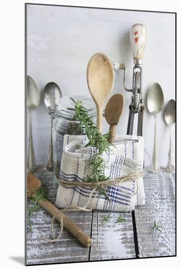 Old Kitchen Utensils: Spoons, Beater, Wooden Spoon and Linen Dish Towel-Martina Schindler-Mounted Photographic Print