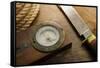 Old Knife, Compass, and Rope on a Old Wooden Desk, Exploration, Survival, and Hunting Concept Image-landio-Framed Stretched Canvas