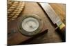 Old Knife, Compass, and Rope on a Old Wooden Desk, Exploration, Survival, and Hunting Concept Image-landio-Mounted Photographic Print