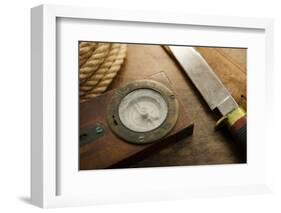 Old Knife, Compass, and Rope on a Old Wooden Desk, Exploration, Survival, and Hunting Concept Image-landio-Framed Photographic Print