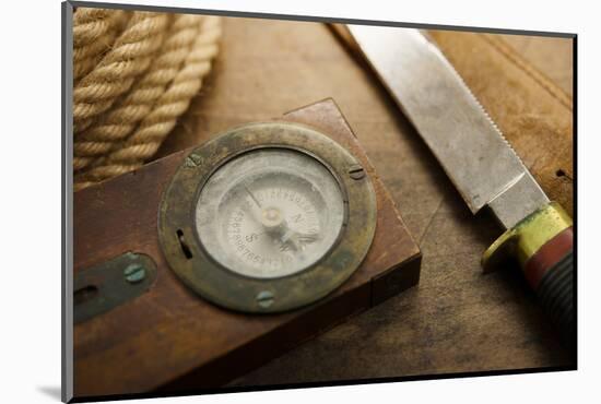 Old Knife, Compass, and Rope on a Old Wooden Desk, Exploration, Survival, and Hunting Concept Image-landio-Mounted Photographic Print
