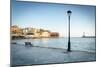 Old lantern in the Venetian harbour of Chania with lighthouse in background, Crete-Roberto Moiola-Mounted Photographic Print