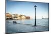 Old lantern in the Venetian harbour of Chania with lighthouse in background, Crete-Roberto Moiola-Mounted Photographic Print