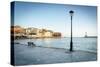 Old lantern in the Venetian harbour of Chania with lighthouse in background, Crete-Roberto Moiola-Stretched Canvas