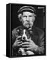Old Man Holding His Hands around a Dog's Throat-Dmitri Kessel-Framed Stretched Canvas