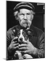 Old Man Holding His Hands around a Dog's Throat-Dmitri Kessel-Mounted Photographic Print