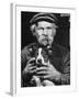 Old Man Holding His Hands around a Dog's Throat-Dmitri Kessel-Framed Photographic Print