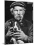 Old Man Holding His Hands around a Dog's Throat-Dmitri Kessel-Mounted Photographic Print