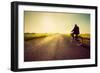 Old Man Riding A Bike On Asphalt Road Towards The Sunny Sunset Sky-Michal Bednarek-Framed Art Print