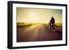 Old Man Riding A Bike On Asphalt Road Towards The Sunny Sunset Sky-Michal Bednarek-Framed Premium Giclee Print