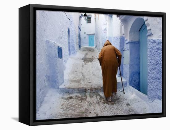 Old Man Walking in a Typical Street in Chefchaouen, Rif Mountains Region, Morocco-Levy Yadid-Framed Stretched Canvas