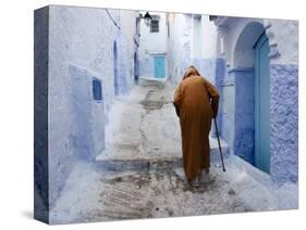 Old Man Walking in a Typical Street in Chefchaouen, Rif Mountains Region, Morocco-Levy Yadid-Stretched Canvas