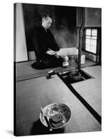 Old Monk Sitting in Cell Meditating and Performing Tea Ceremony-Howard Sochurek-Stretched Canvas