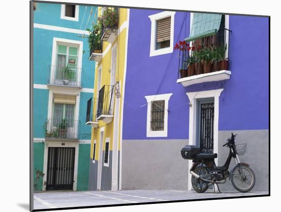 Old Motorcycle Outside a Purple Painted House in Villajoyosa, in Valencia, Spain, Europe-Mawson Mark-Mounted Photographic Print