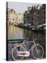 Old Pink Bicycle by the Herengracht Canal, Amsterdam, Netherlands, Europe-Amanda Hall-Stretched Canvas