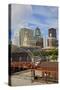 Old Railroad Station framing view of Des Moines skyline, capital of Iowa-null-Stretched Canvas