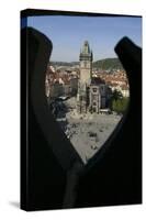 Old-Town Cityhall Tower Seen Through a Quatrefoil in the Stone Gothic Parapet of Týn Church's West-null-Stretched Canvas