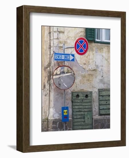 Old town house and traffic signs. Predazzo in valley Val di Fiemme, in the Dolomites Italy.-Martin Zwick-Framed Photographic Print