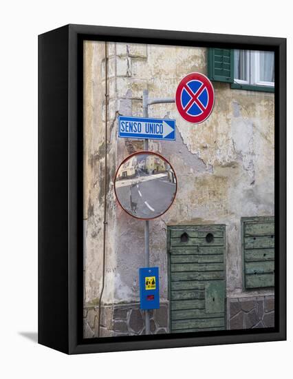 Old town house and traffic signs. Predazzo in valley Val di Fiemme, in the Dolomites Italy.-Martin Zwick-Framed Stretched Canvas