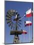 Old Water Pump and Texas State Flags, Amarillo, Texas-Walter Bibikow-Mounted Photographic Print