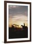 Old West, New West, Man Sitting on Horse with Oil Refinery at Sunset-David R^ Frazier-Framed Photographic Print