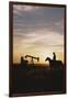 Old West, New West, Man Sitting on Horse with Oil Refinery at Sunset-David R^ Frazier-Framed Photographic Print