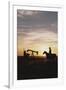 Old West, New West, Man Sitting on Horse with Oil Refinery at Sunset-David R^ Frazier-Framed Photographic Print