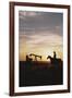 Old West, New West, Man Sitting on Horse with Oil Refinery at Sunset-David R^ Frazier-Framed Photographic Print