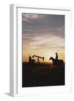 Old West, New West, Man Sitting on Horse with Oil Refinery at Sunset-David R^ Frazier-Framed Photographic Print