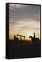 Old West, New West, Man Sitting on Horse with Oil Refinery at Sunset-David R^ Frazier-Framed Stretched Canvas