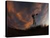 Old Windmill Silhouetted Against Clouds Colored by the Setting Sun-null-Stretched Canvas