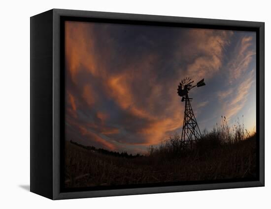 Old Windmill Silhouetted Against Clouds Colored by the Setting Sun-null-Framed Stretched Canvas