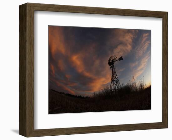 Old Windmill Silhouetted Against Clouds Colored by the Setting Sun-null-Framed Photographic Print