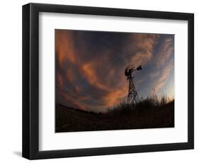 Old Windmill Silhouetted Against Clouds Colored by the Setting Sun-null-Framed Photographic Print