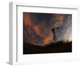 Old Windmill Silhouetted Against Clouds Colored by the Setting Sun-null-Framed Photographic Print